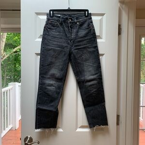 Distressed black button fly jeans